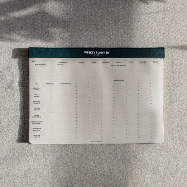 A4 green weekly planner pad with shadows